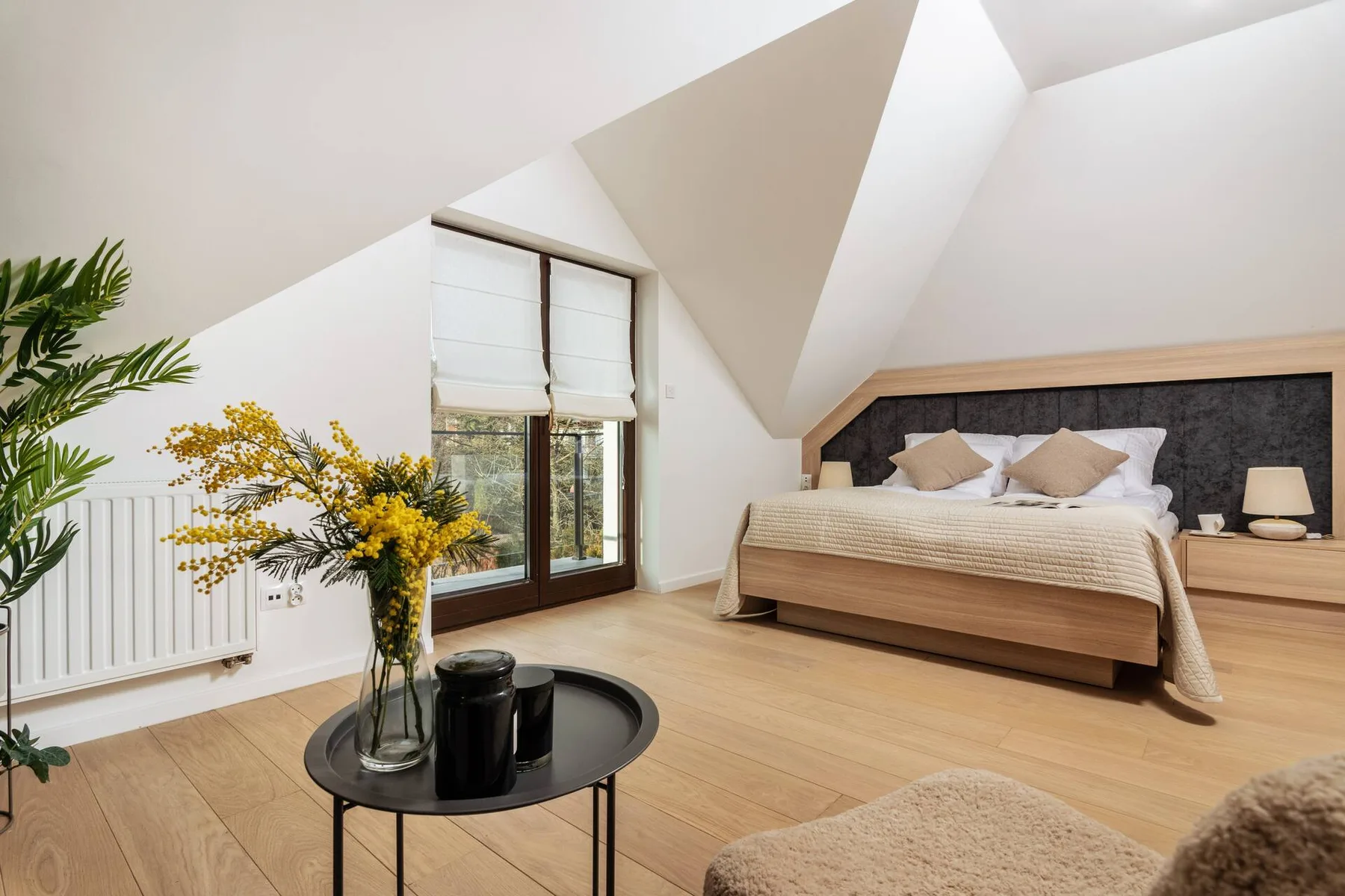 Master bedroom under the eaves with balcony